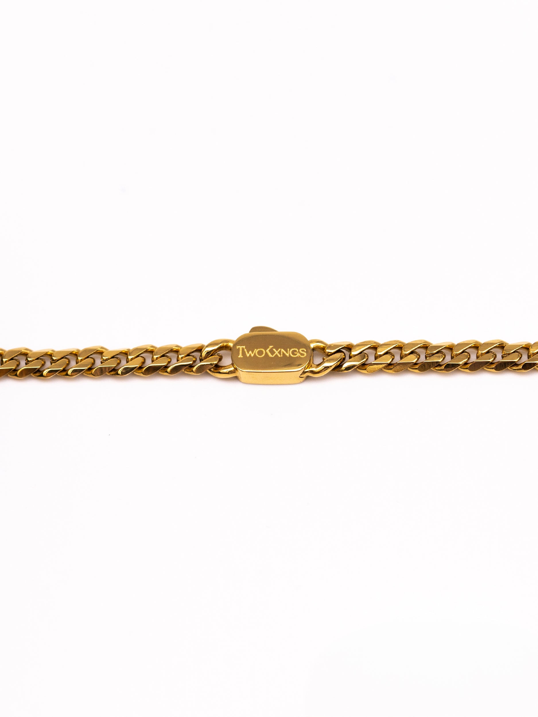 Close up of the Two Kxngs name engraved on the Basileus gold cuban chain