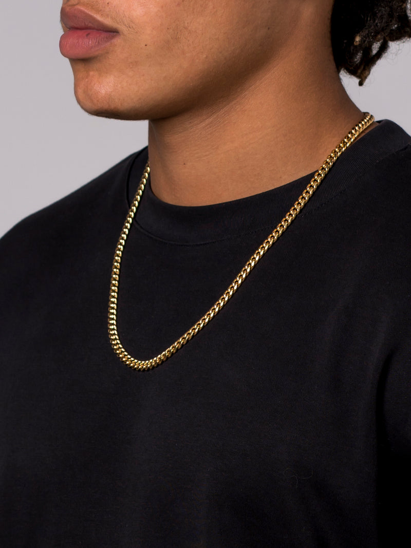 Man wearing the Midas 6mm gold Miami Cuban chain